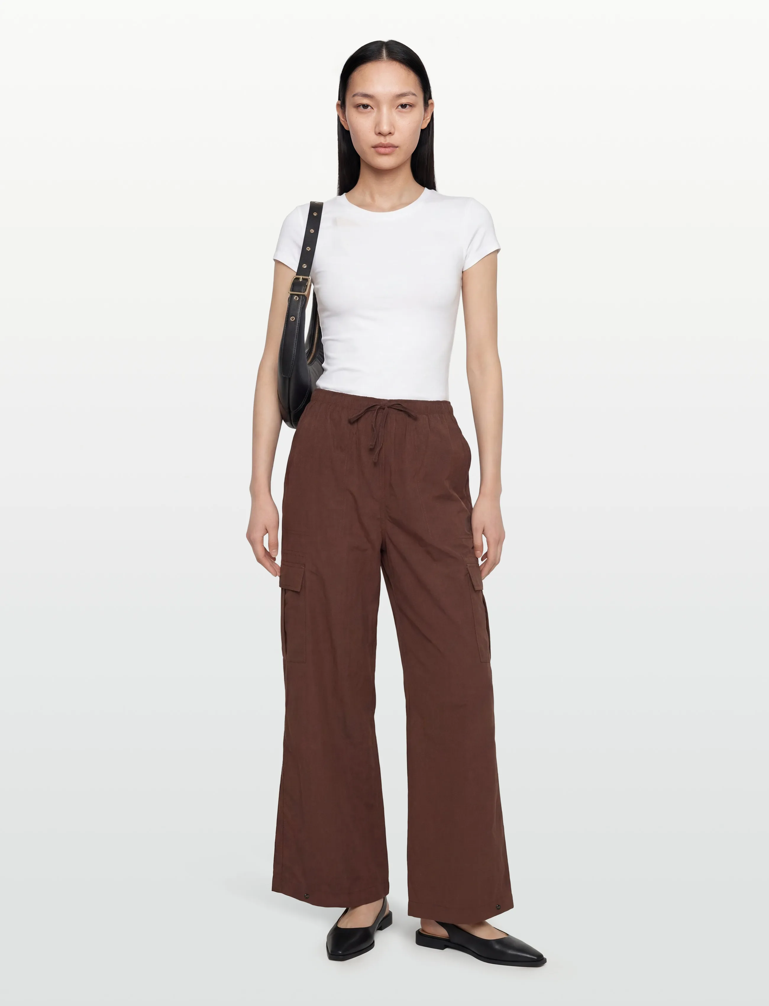 New Balance Woven Cargo Pant - Sports pants - PUMPERNICKEL / brown