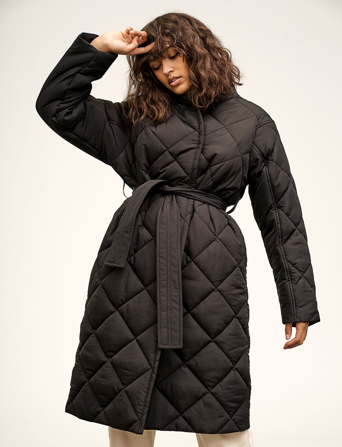 Black quilted coat with top belt