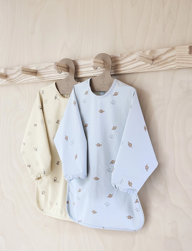 OYOY MINI - Dino Cape Bib - madalaimad hinnad - butter - 1