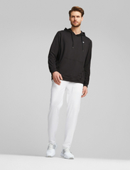 PUMA Golf - Puma x PTC Midweight Hoodie - hupparit - puma black - 4