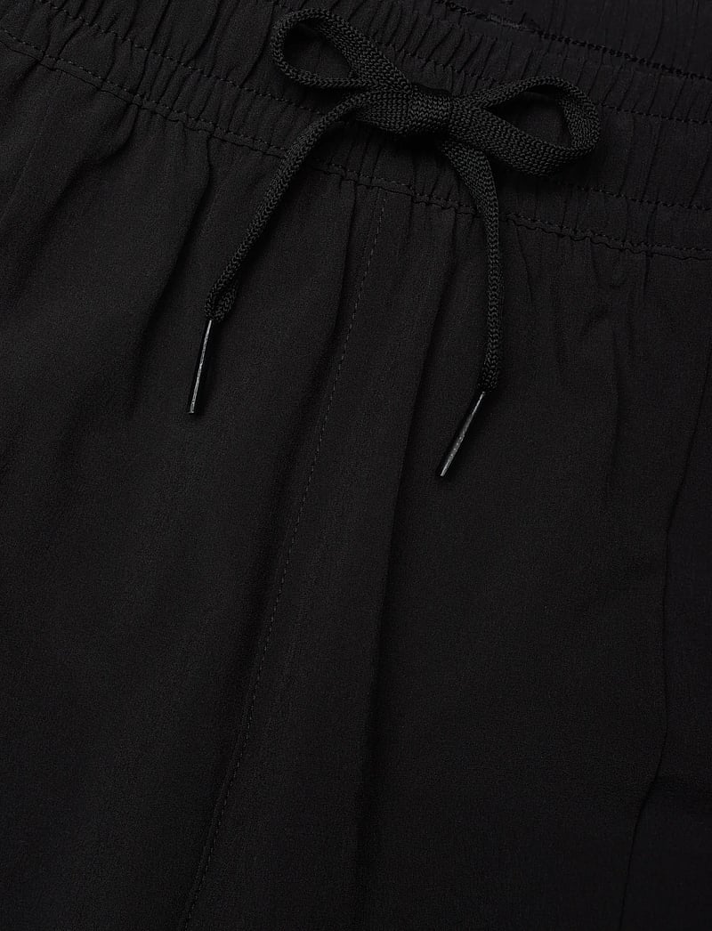 PUMA - M FLEX STRETCH WOVEN PANT - sporta bikses - puma black - 4