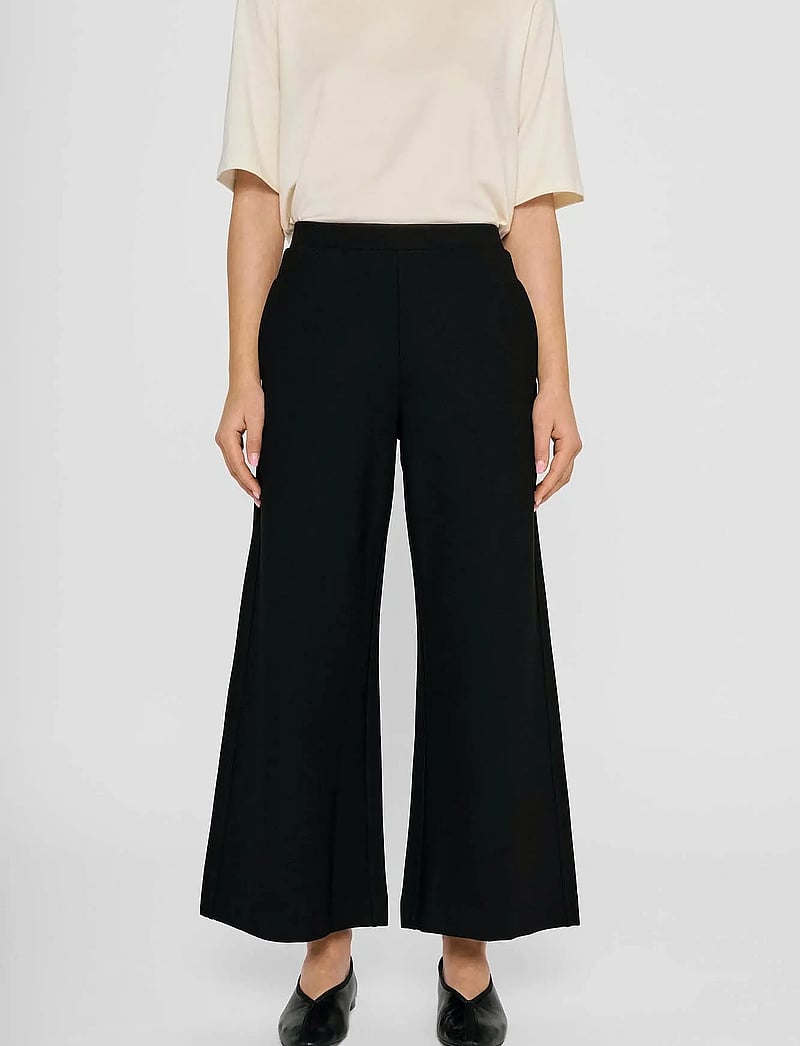 Residus - LOTTIE WIDE PANTS - wide leg trousers - black - 0