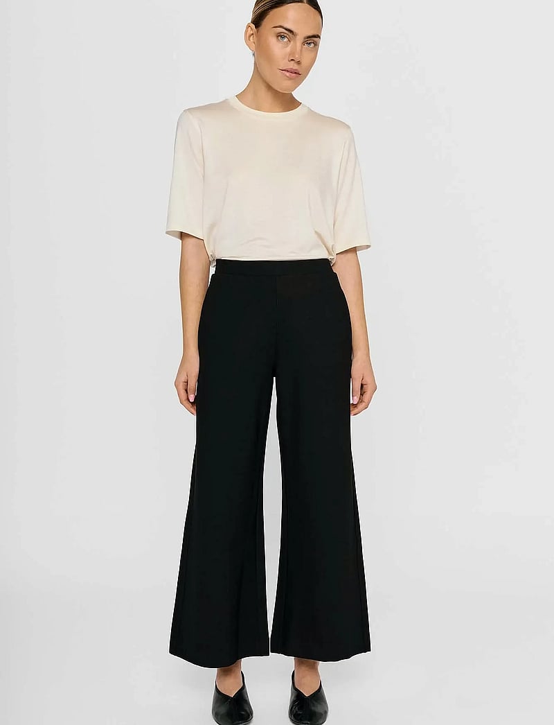 Residus - LOTTIE WIDE PANTS - wide leg trousers - black - 5