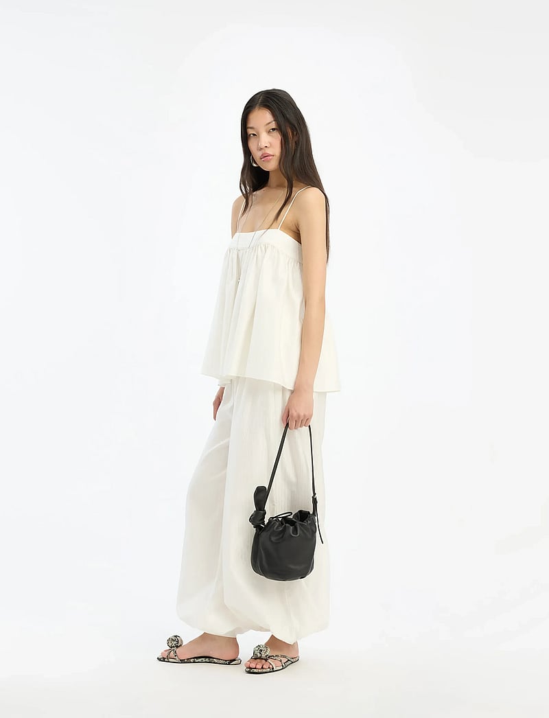 ROTATE - STRIPED BALLOON PANTS - wide leg trousers - bright white - 0