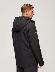 Superdry Sport - SKI FREESTYLE CORE JACKET - ski jackets - black - 3