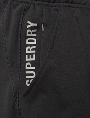 Superdry - CODE TECH SLIM JOGGER - spodnie treningowe - black - 2