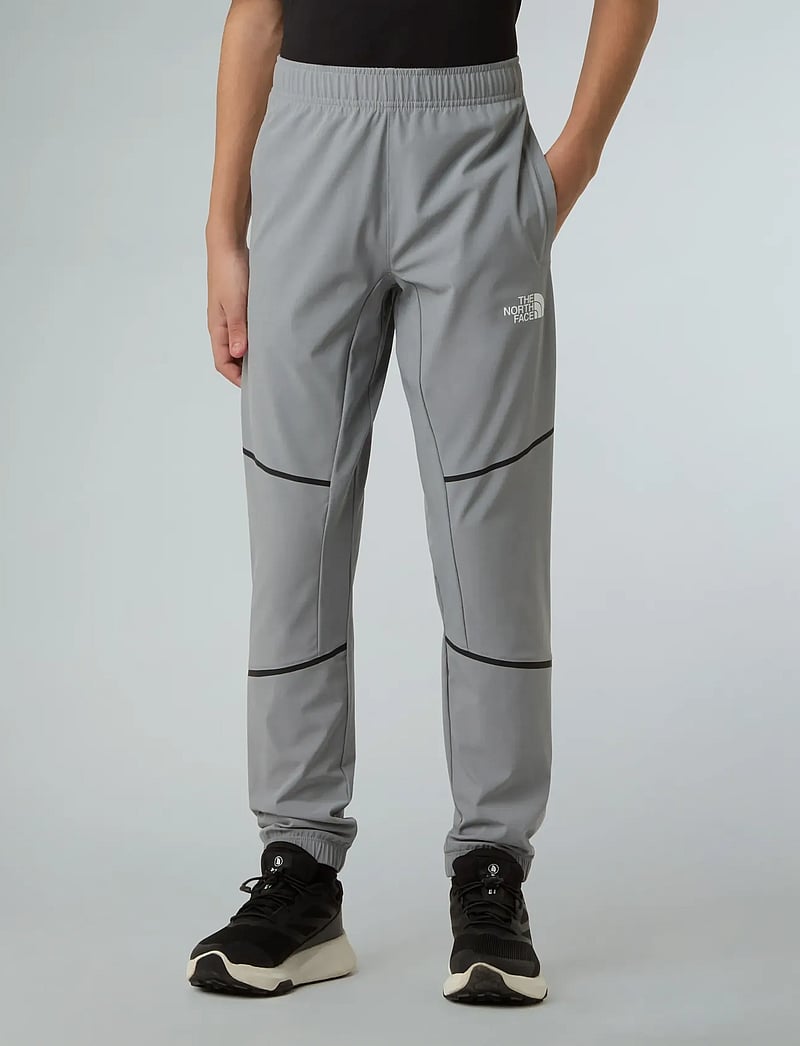 The North Face - TEEN MOUNTAIN ATHLETICS WOVEN PANT - sportiska stila bikses - monument grey - 0