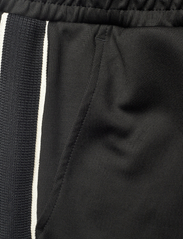 Tommy Hilfiger - MONOTYPE TRACK SWEATPANTS - spodnie dresowe - black - 4