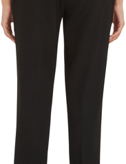 Tommy Hilfiger - SLIM STRAIGHT TRAVEL PANT - tailored trousers - black - 8