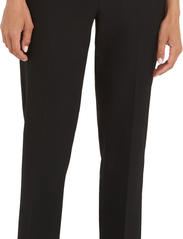 Tommy Hilfiger - SLIM STRAIGHT TRAVEL PANT - tailored trousers - black - 9