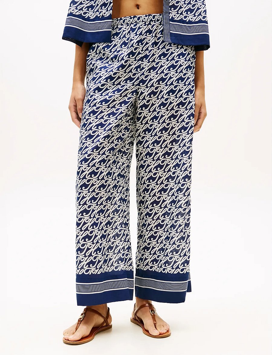 Tommy Hilfiger - SWIMSHOP SILK VOILE AOP PANTS - bukser med brede ben - th script preppy navy - 0