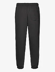 Tommy Jeans - TJM RLX SOLID XS BADGE SWEATPANT - spodnie dresowe - black - 1