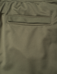Under Armour - SPORTSTYLE TRICOT JOGGER - sports pants - marine od green - 7